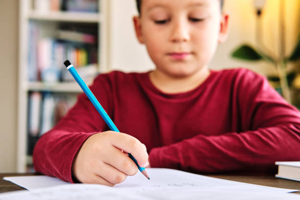 istock Education at home. Cute child learning mathematics at home. Homeschooling 1271939435