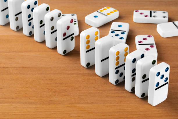 istock White domino dice on a wooden table 1271941212