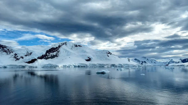 istock Blue glaciers and dramatic sky on Antarctica 1271941361
