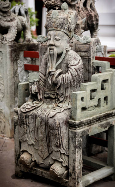 istock Chinese Mandarin in seated position stone sculpture 1271943884