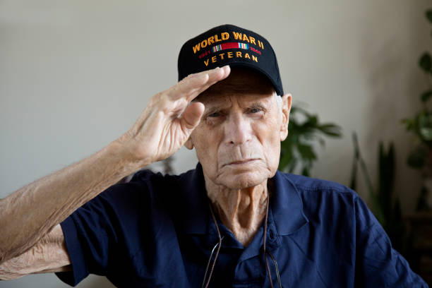 istock World War Two Veteran saluting looking at camera 1271946665