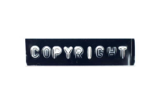 istock Embossed letter in word copyright on black banner with white background 1271950338