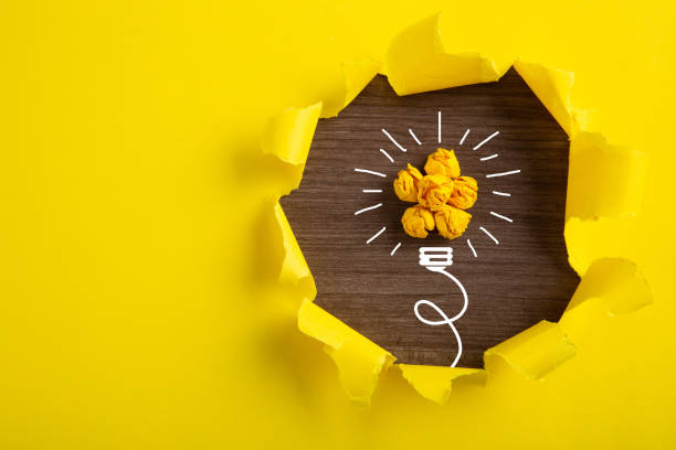 istock Creative idea, Inspiration, New idea and Innovation concept with Crumpled Paper light bulb on yellow background. 1271951677