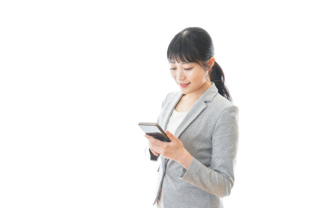 istock Business Woman using a smartphone app 1271953310