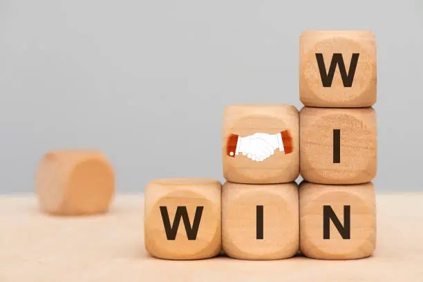 Photo of win win situation printed on wooden cubes