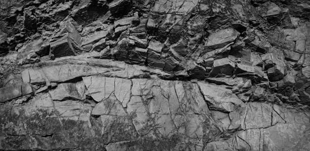 istock Black and white background. Volumetric black stone background. 3d effect. Rock texture. Stone wall. 1271954727