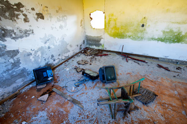 Abandoned room with television and chair