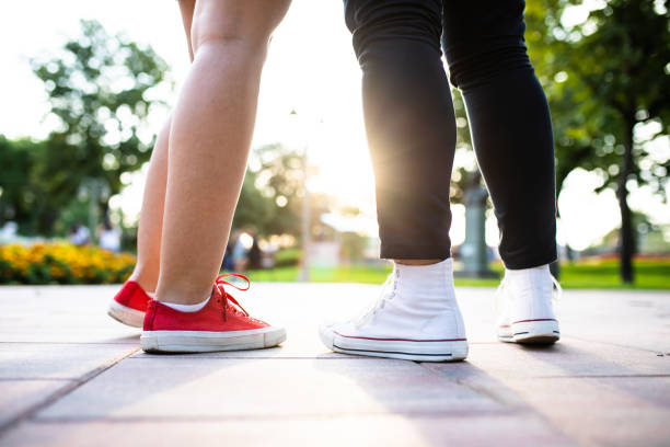 istock Legs of a couple knees down 1271959403