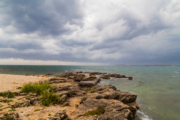 istock Dramatic storm clouds and rain over the Adriatic Sea 1271965058