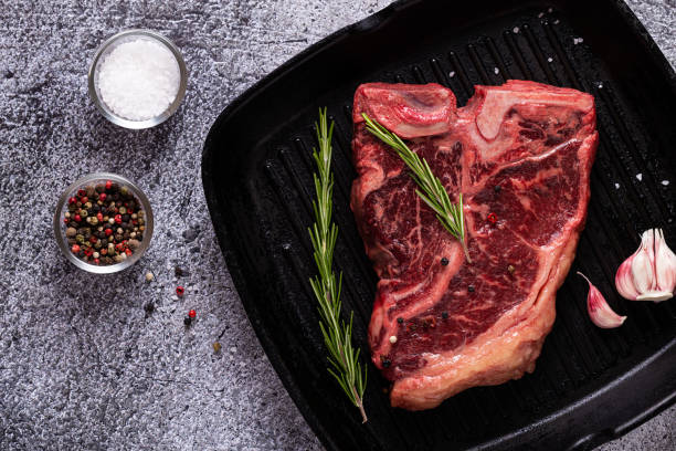 istock Fresh raw t-bone steak on frying grill pan 1271967810