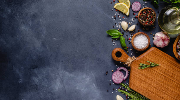 istock Herbs and condiments on black stone background 1271969036