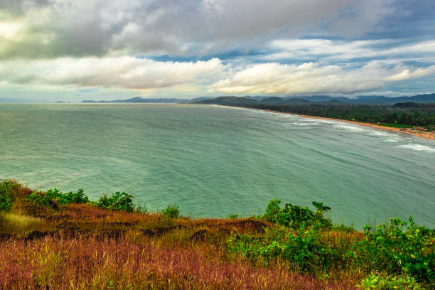 istock mountain top view of sea shore with clouded sky 1271976000