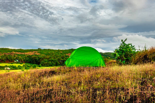 istock camping solo at mountain top with clouded sky 1271976025