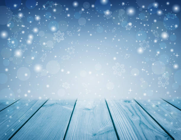 istock Abstract Christmas light blue background. winter season. background with snowfall. White snowflakes on blue sky. 1271978703
