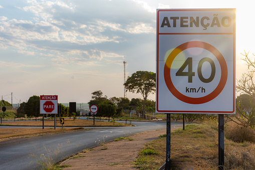 Paved highway with signs on the sides