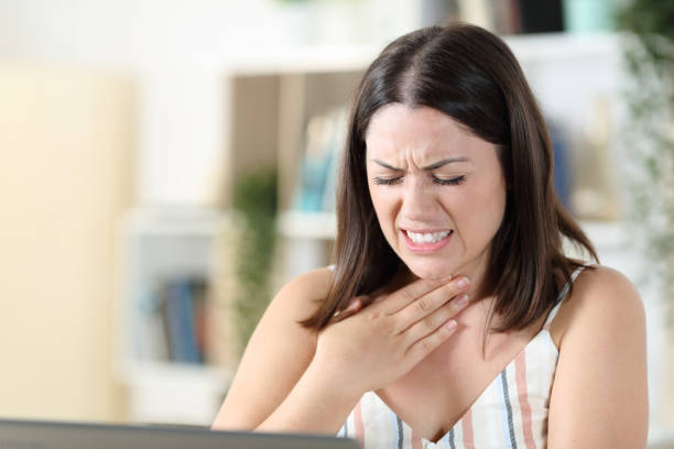 istock Woman suffering throat ache complaining at home 1271990318
