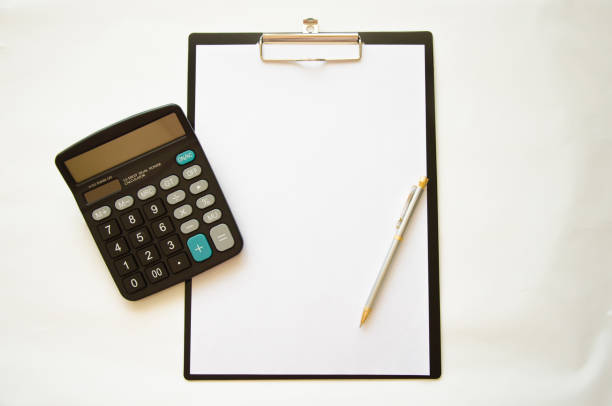 istock money calculator and pen lie on the table 1271990503