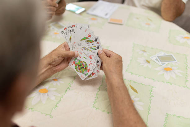istock Close up man hand with playing card 1271991659