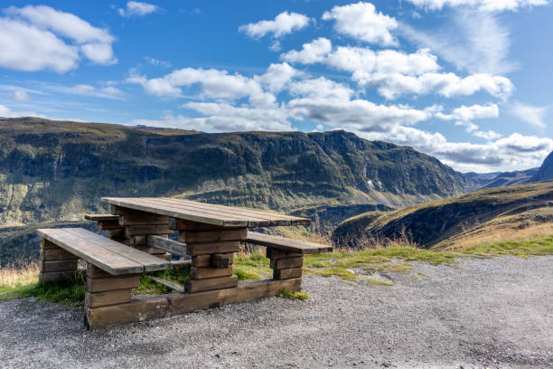 istock Wooden bench, norwegian mountains rest viewpoint 1271992410