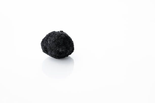 istock An old duck egg recipe in ash. Salty pickled duck egg in ash on a white background 1271994054