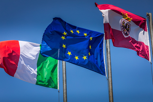 The flags of the Poland and the European Union waving in the wind on a clear day. Poland became a member of the EU in may 2004. 3d illustration render. Fluttering fabric