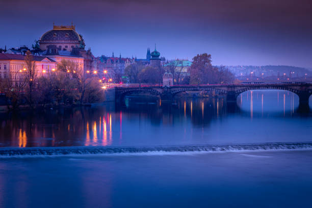 prague panorama with bridge and vltava river at night – czech republic - prague mirrored pattern bridge architecture imagens e fotografias de stock