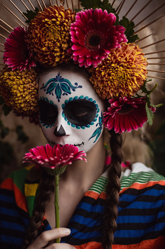 Portrait of woman with traditional make up for Dia de los Muertos