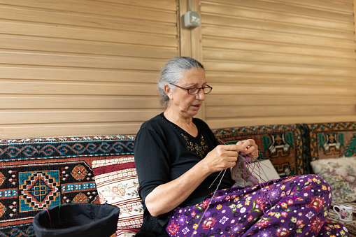 Senior woman's hands knitting