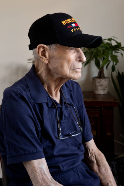 istock World War Two Veteran sitting at home looking towards window contemplating 1272001887