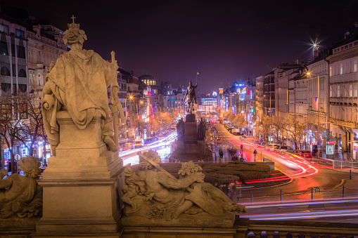 Illuminated Wenceslas Square at night with blurred cars motion – ethereal Prague, Czech Republic
