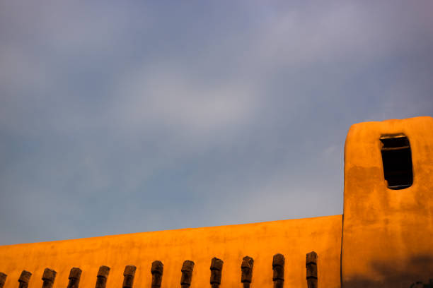 Santa Fe, NM: Typical Adobe Architecture, Illuminated at Dusk. Copy space available.