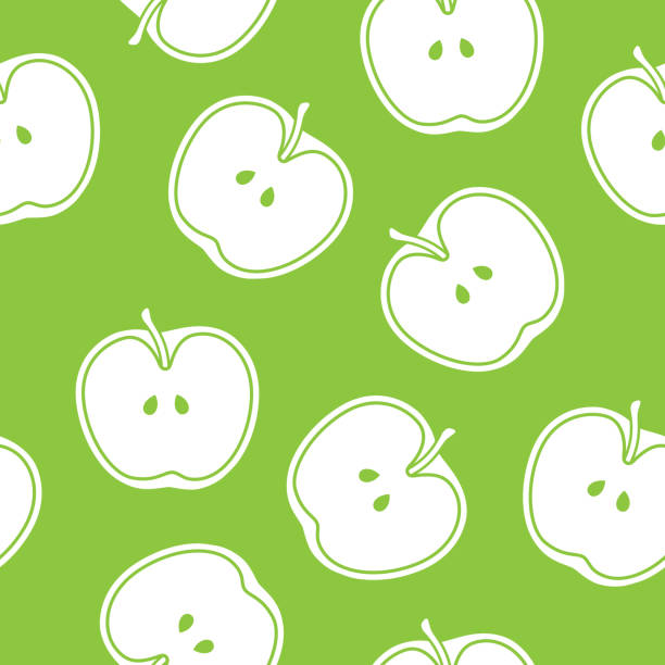 Green Apple Cut in Half Pattern Silhouette Vector illustration of apples cut in half in a repeating pattern against a green background. green apple on green background stock illustrations
