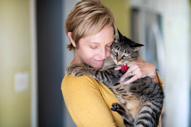 istock Woman Hugging Her Cat 1272014783