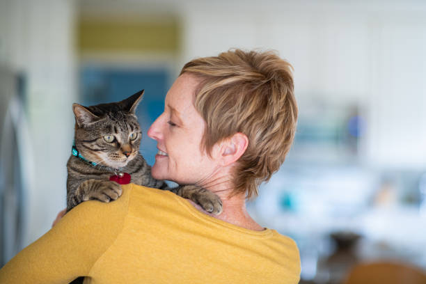 istock Woman Holding Her Cat 1272014786