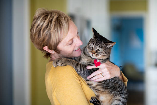 istock Woman Holding Her Cat 1272014789