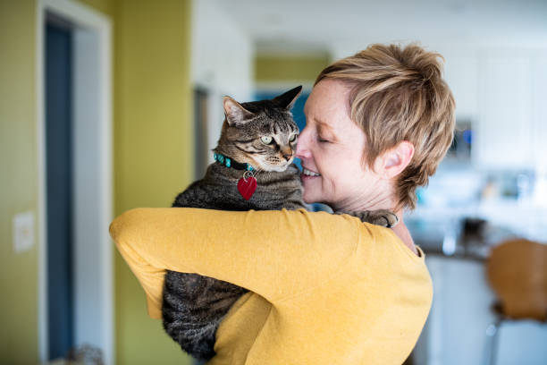 istock Woman Hugging Her Cat 1272014794