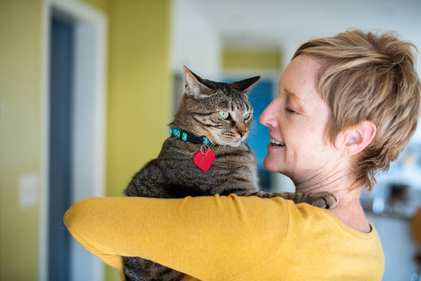 istock Woman Holding Her Cat 1272014796