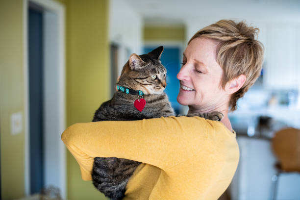 istock Woman Holding Her Cat 1272014797