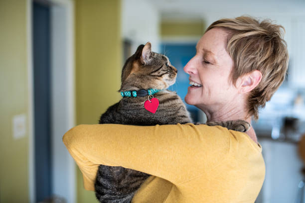 istock Woman Holding Her Cat 1272014799