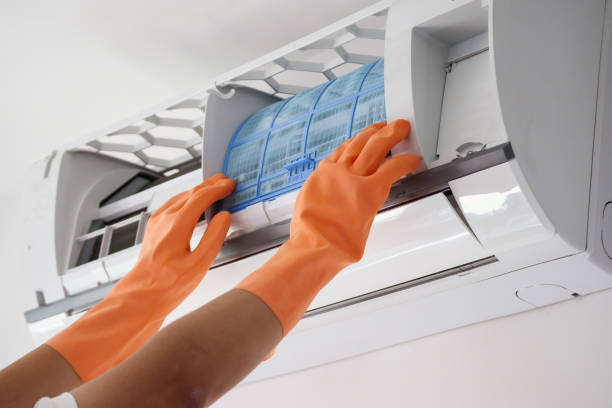 istock Asian man hand hold air conditioner filter cleaning concept 1272017183