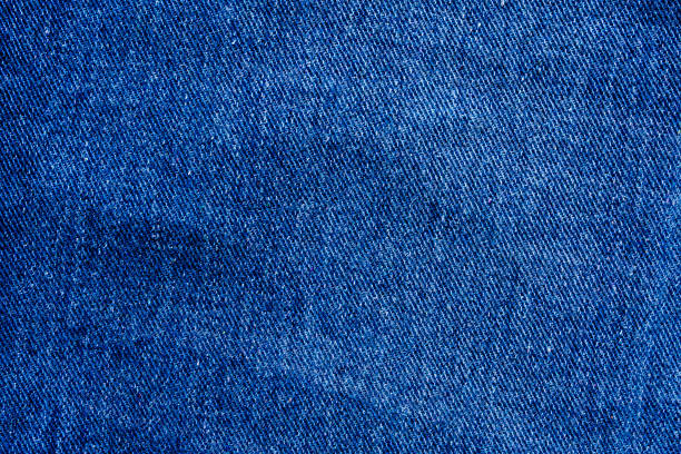 istock Denim blue jeans texture close up background top view 1272017188