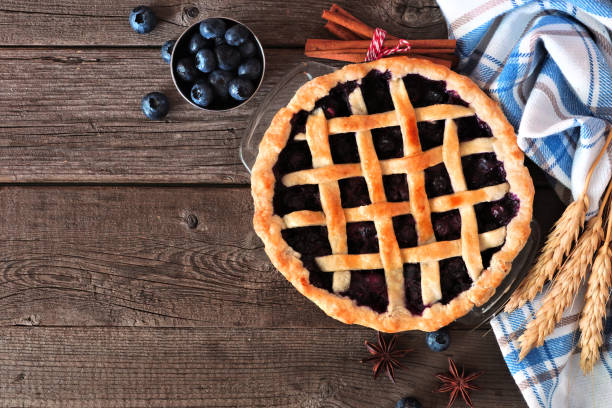 istock Homemade blueberry pie, top view table scene over a rustic wood background 1272017624