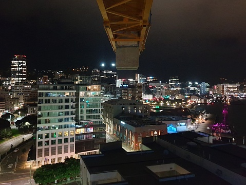 Crane overlooking Wellington city with the harbor to the right and the Majestic Center to the left.
