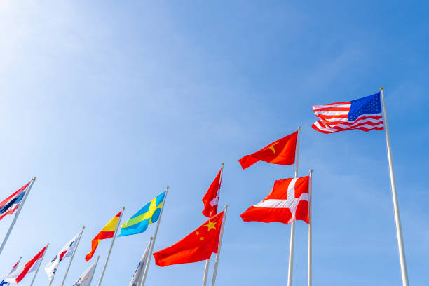 istock Flagpole international global with blue sky background 1272020647