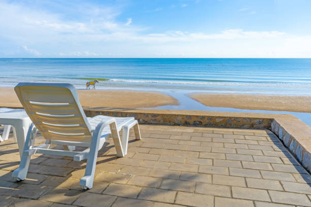 istock Chair white plastic on beach chair ocean seascape 1272023441