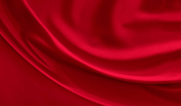 black red satin dark fabric texture luxurious shiny that is abstract silk cloth background with patterns soft waves blur beautiful. - red cloth imagens e fotografias de stock