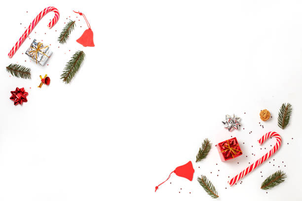 istock Gifts, candies, fir tree branches, red decorations on white background. 1272032061