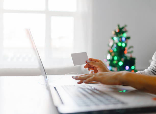 istock Women shopping online during christmas 1272032678