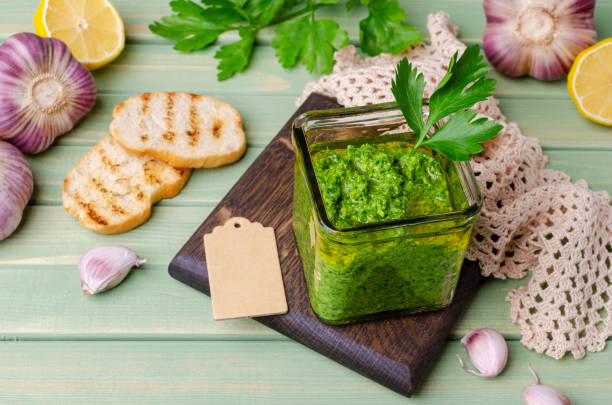 istock Green sauce in a glass jar 1272034475
