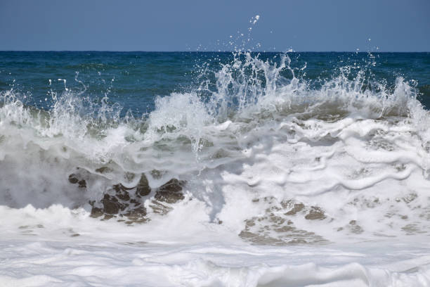 istock Sea waves break on the shore 1272035208